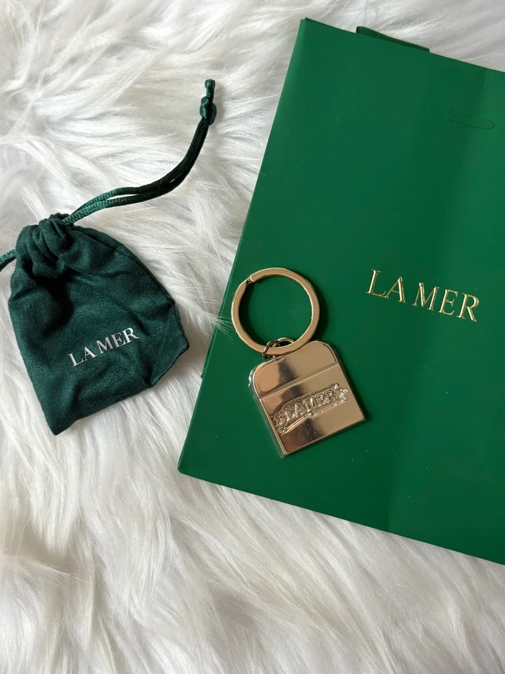 La Mer Gold Padlock Keyring with Green Pouch Sealed in mica